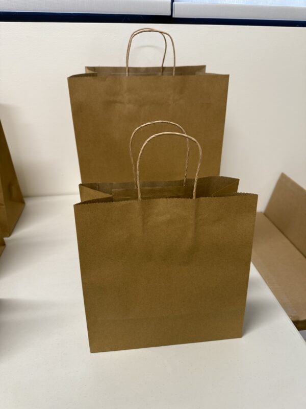 A brown paper bag sitting on top of a table.