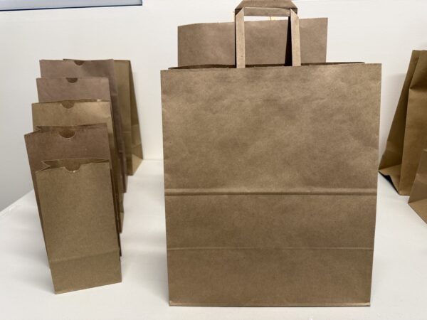 A brown paper bag sitting on top of a table.