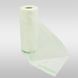 A roll of plastic wrap is sitting on the floor.